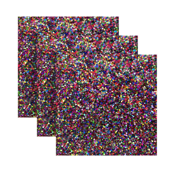 Three sheets of multicolored glitter paper on a white background