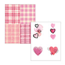 Pink plaid paper and heart-shaped stickers on a white background