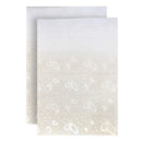 White card with geometric pattern and matching envelope on a white background
