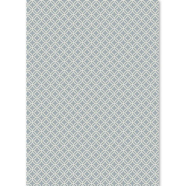 Patterned rug with geometric design on a white background