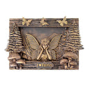 Bronze-colored belt buckle with fairy design and 'I ❤️ Fairies' text, surrounded by trees and mushrooms.