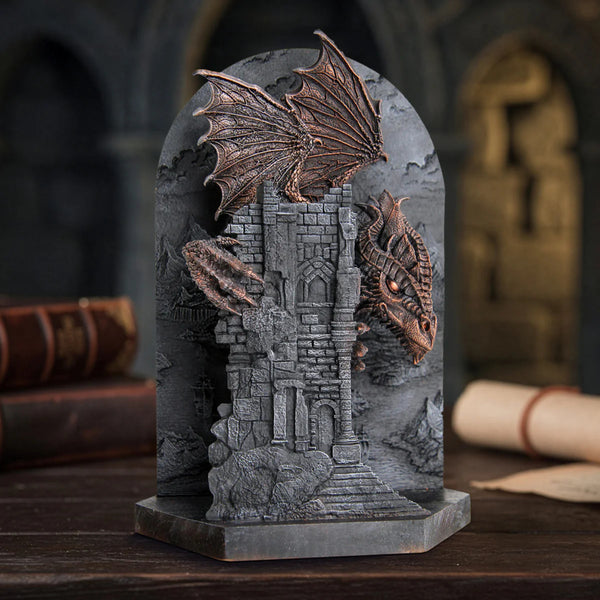 Decorative stone arch with dragon sculptures on a dark background