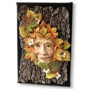Decorative wall art with a face made of leaves and flowers on a textured background