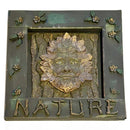 Decorative plaque with a face of a green man and the word 'NATURE' on a white background