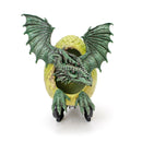 Green dragon figurine on a yellow spherical base with a white background