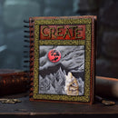 Decorative notebook with 'CREATE' text and wolf illustration on a dark background