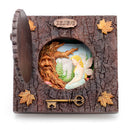Decorative box with fairy and tree spirit design, featuring a key and 'BELIEVE' inscription.