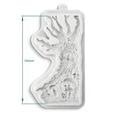 Silicone mold with tree and face design, showing dimensions on a white background