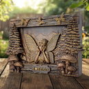 Decorative plaque with fairy design on a wooden surface