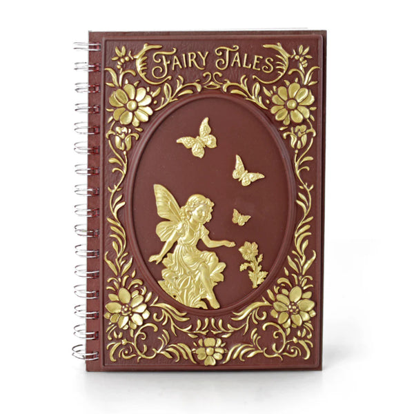 Notebook with gold fairy and floral design on a white background