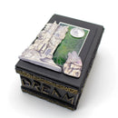 Decorative box with 'Dream' text and castle design on a white background