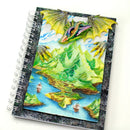 Notebook with a dragon and mountain landscape design on the cover