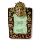 Decorative plaque with a leafy face design and 'Memories' text on a white background