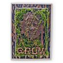 Decorative wall art with a green man design and 'GROW' text, framed with natural elements.