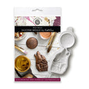 Silicone mould packaging with decorative items on a white background