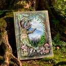 Decorative plaque with nature-themed design in a forest setting
