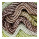 Close-up of multicolored yarn with brown, beige, and green tones.