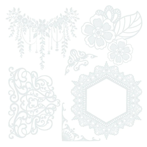 Set of decorative white lace doilies on a white background