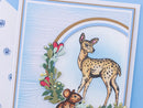 Card with a deer and mouse illustration on a blue background