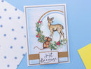 Greeting card with deer and mouse illustration on a blue background