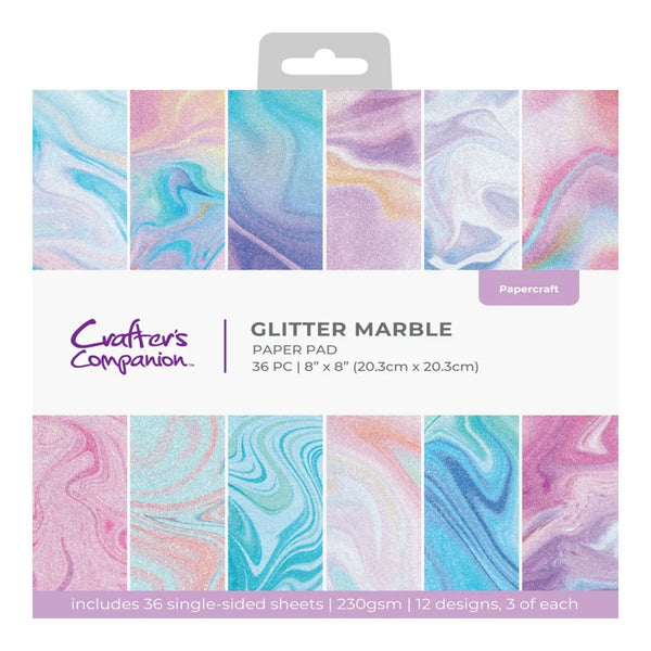 Packaging of Crafters Companion glitter marble paper pad with colorful swatch samples.