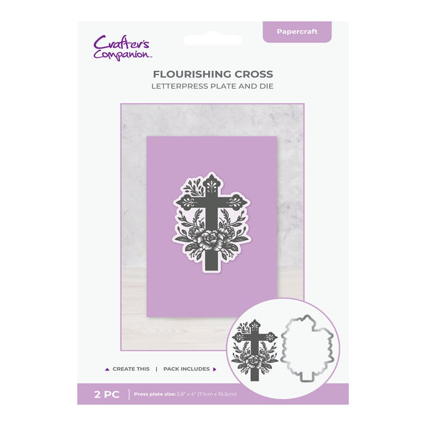 Flourishing cross letterpress plate and die set packaging with purple background and white border.