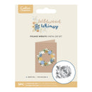 Package of Wildwood Whimsy foliage wreath metal die set with floral design on beige background