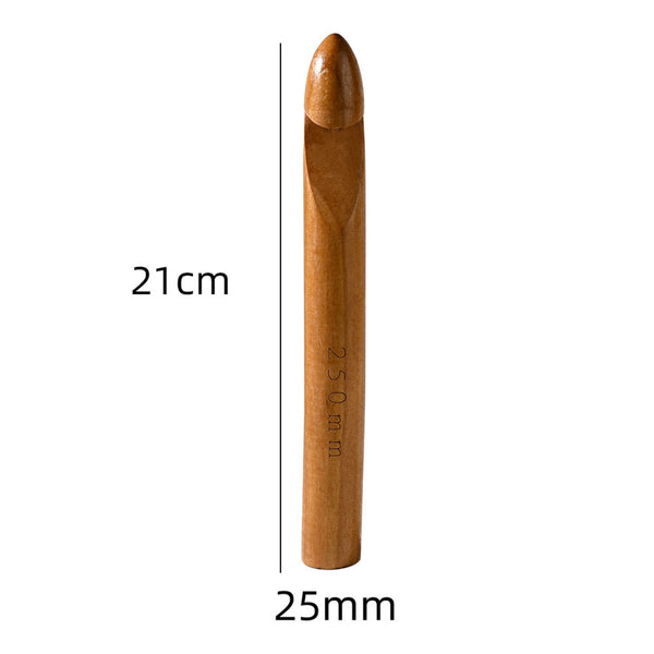 A wooden crochet hook with a pointed tip, shown vertically on a white background with dimension labels indicating 21 cm height and 25 mm width.