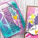 Two artistic cards with feather designs on a wooden surface