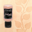 Bottle of Dylusions spray paint on a beige background with leaf pattern