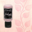 Bottle of Dylusions Cotton Candy Paint on a pink background with leaf pattern