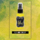 Yellow ink spray bottle labeled 'Lemon Drop' on a green and yellow patterned background