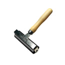 Metal tool with wooden handle on a white background