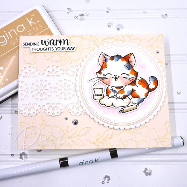 Card with a cat illustration and 'Sending warm thoughts your way' text, featuring Gina K. Designs products.