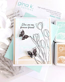 Card with floral and butterfly design, Gina K. Designs stamps and ink pad in the background