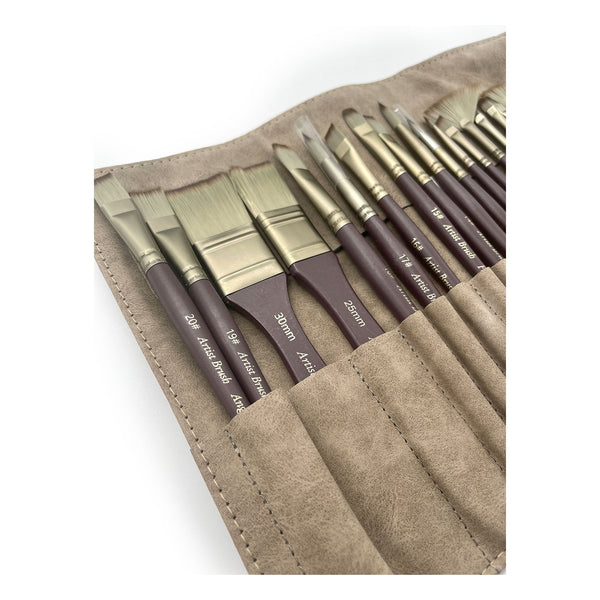 Set of paint brushes in a brown leather case on a white background