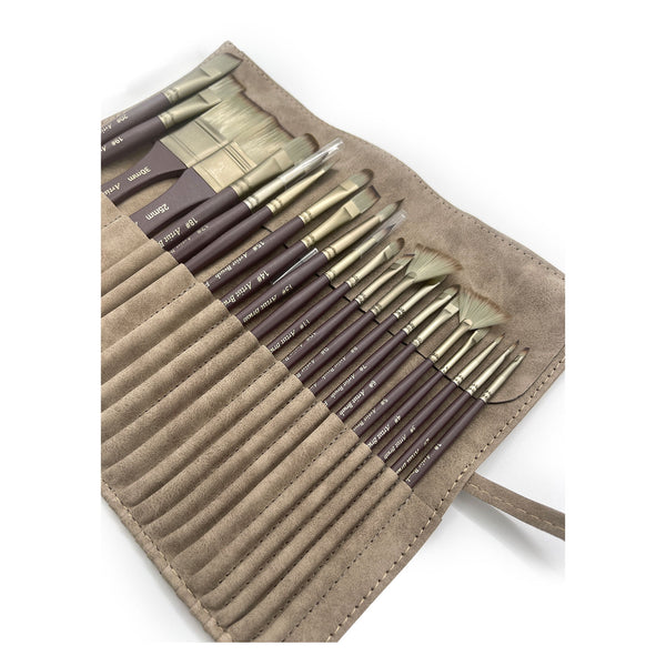 Set of paint brushes in a brown leather case on a white background