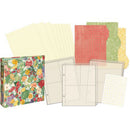 Collection of patterned paper sheets and a floral notebook on a white background