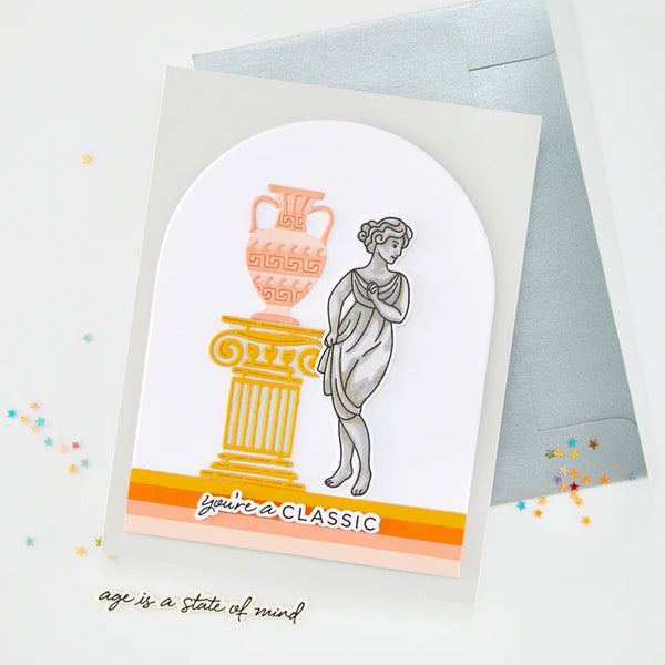 Greeting card with classical design elements and text 'you're a CLASSIC' on a light background.