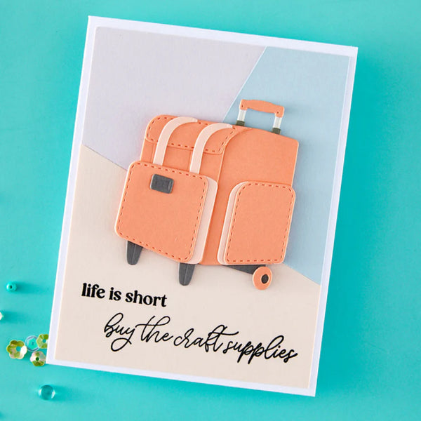 Card with orange suitcase design and text 'life is short, buy the craft supplies' on a teal background.
