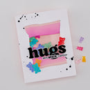 Card with a pink envelope and colorful stickers on a white background
