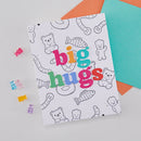 Coloring book with 'big hugs' text and animal illustrations on a light gray background
