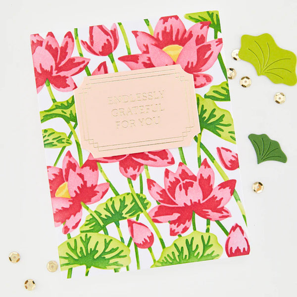 Floral card with pink flowers and green leaves, featuring a bar of soap with 'Thankful' text on a white background.