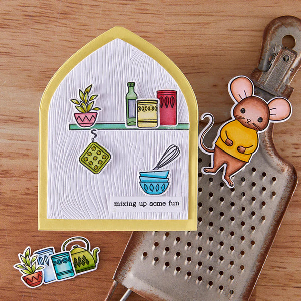 Decorative mouse sticker with a kitchen-themed design on a wooden surface