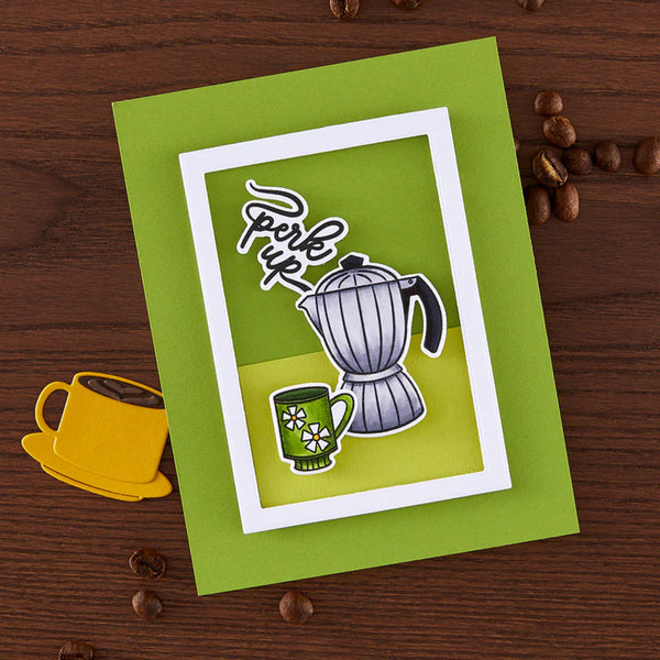 Green card with coffee-themed illustrations on a wooden surface with coffee beans.