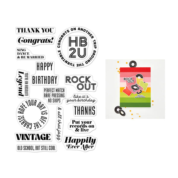 A sheet of black and white craft stamps with various typography designs, shown next to a colorful card template featuring a pink, orange, yellow, and green retro design with the words 'ROCK OUT' and 'HAPPY BIRTHDAY'.