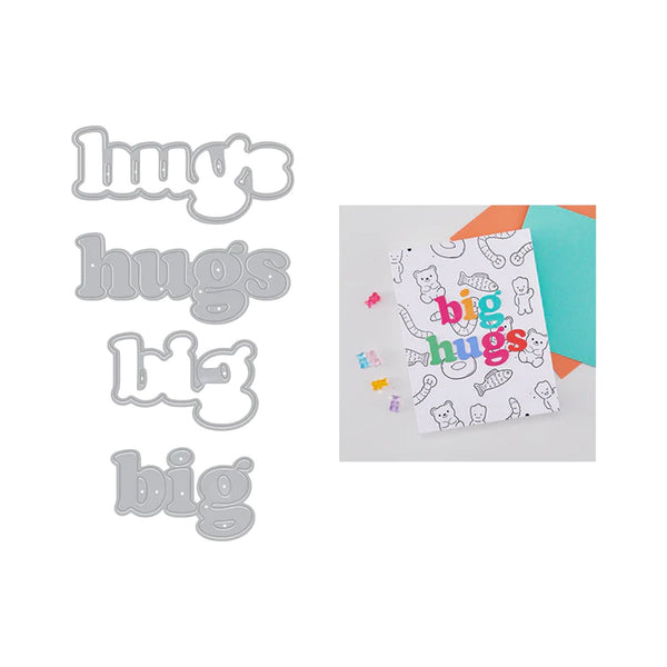 Metallic letter stamps spelling 'hugs', 'big hugs', and 'big' with a card featuring colorful text and illustrations.