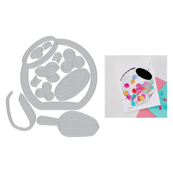 Metal die cutters with a colorful card featuring a paint palette design on a white background