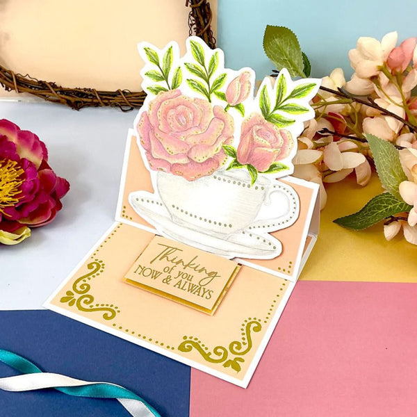 Greeting card with floral design and 'Thinking of you NOW & ALWAYS' message on a colorful background.