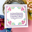 Greeting card with floral design and text 'Let's make more memories together' on a colorful background.